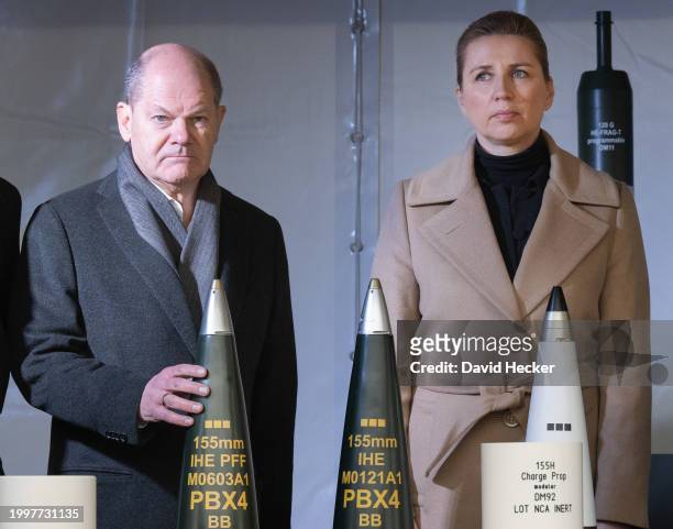 German Chancellor Olaf Scholz and Danish Prime Minister Mette Frederiksen during a short walk through a weapons exhibition with artillery ammunition...