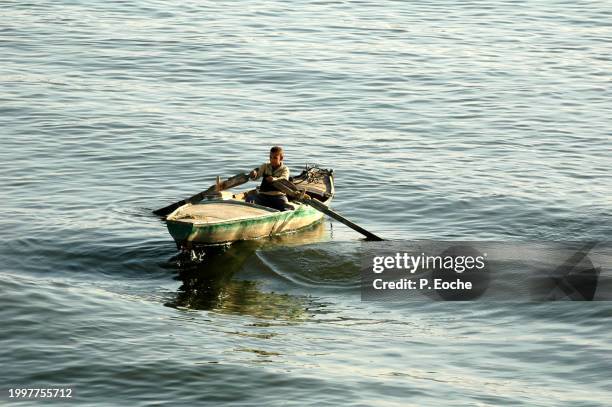 egypt, fisherman in boat on the nile - transport nautique stock pictures, royalty-free photos & images