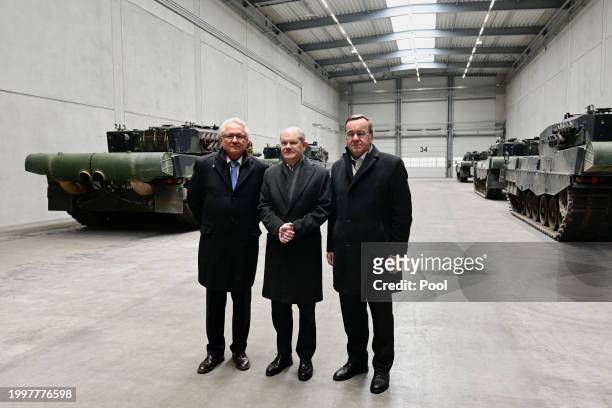 German Chancellor Olaf Scholz , German Defence Minister Boris Pistorius and CEO of Rheinmetall Armin Papperger pose by Leopard 2 tanks as they attend...
