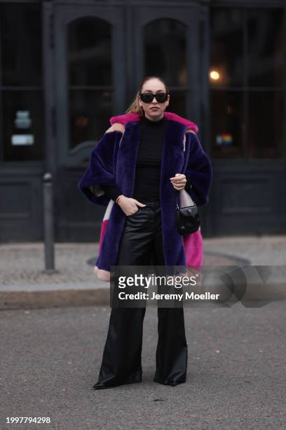 Sonia Lyson seen wearing & Other Stories black sunglasses, silver earrings, black wool knit high neck sweater, Marina Hoermanseder pink, purple,...