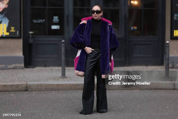 Sonia Lyson seen wearing & Other Stories black sunglasses, silver earrings, black wool knit high neck pullover, Marina Hoermanseder pink, purple,...