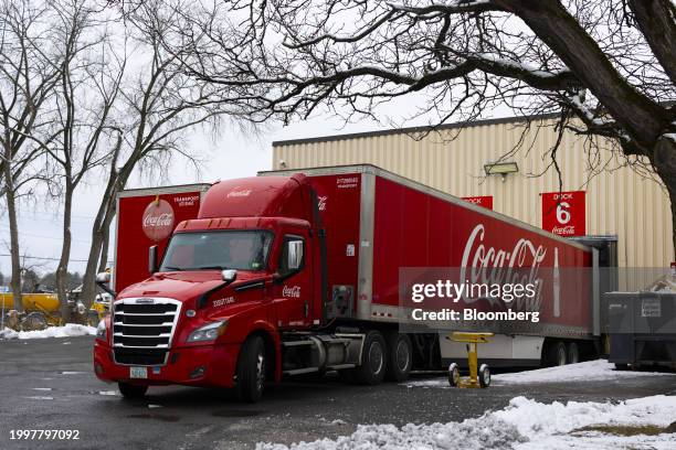 Trucks outside the Coca-Cola bottling plant in Albany, New York, US, on Tuesday, Jan. 30, 2024. Coca-Cola Co. Is scheduled to release earnings...