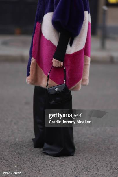 Sonia Lyson seen wearing Marina Hoermanseder pink / purple / white / beige fake fur hooded short coat, Marc Cain black leather wide leg pants, Prada...