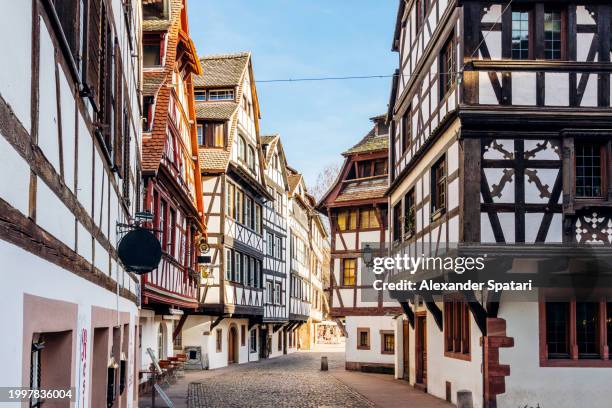 street with traditional historic houses in petite france - travatura a traliccio foto e immagini stock