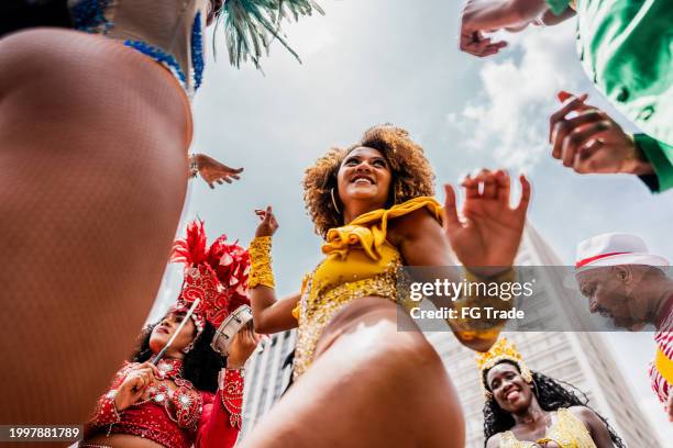 mid adult woman dancing at a street carnival party - rio de janeiro party stock pictures, royalty-free photos & images