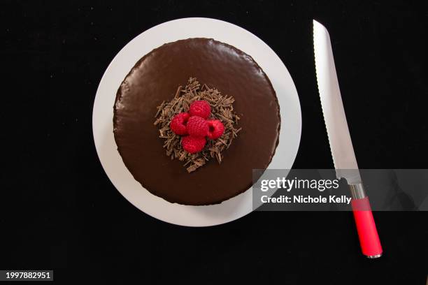 chocolate cake with knife - sachertorte stock-fotos und bilder