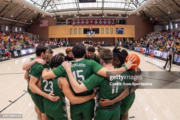 Dartmouth Big Green players huddle as a team before the college basketball game between the Dartmouth Big Green and the Harvard Crimson on February...