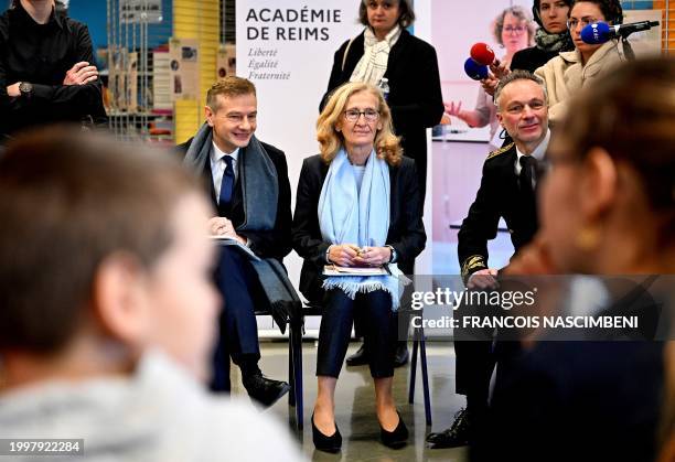 France's Minister for Education and Youth Nicole Belloubet meets pupils next to Reims deputy prefect Benoit Lemaire during a visit focused on school...