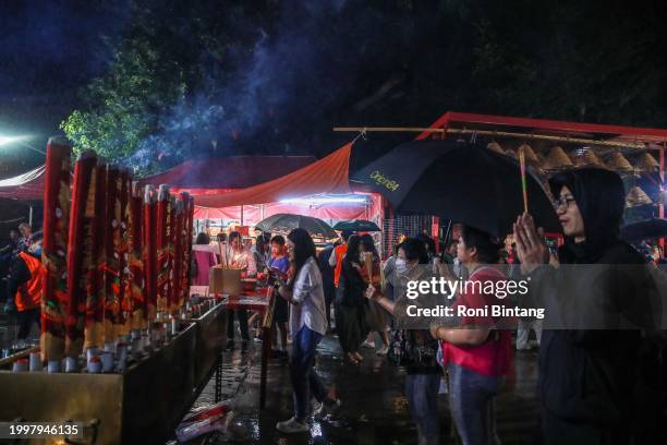 Worshipers pray at Sze Yup Kwan Ti temple on Lunar New Year's Eve on February 09, 2024 in Sydney, Australia. Lunar New Year was observed at the...