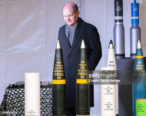German Chancellor Olaf Scholz with artillery ammunition before the groundbreaking ceremony for a new munitions factory of German defence contractor...