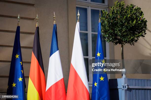 Flags are pictured during the meeting of the Weimar Triangle on February 12, 2024 in La Celle-Saint-Cloud, France. At the Weimar Triangle politicians...