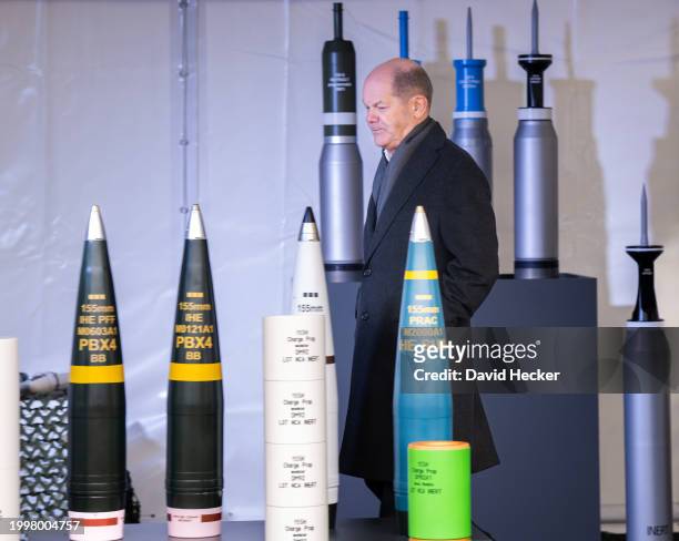 German Chancellor Olaf Scholz with artillery ammunition before the groundbreaking ceremony for a new munitions factory of German defence contractor...