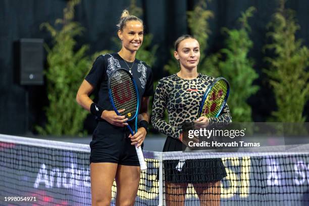 Arantxa Rus of Netherlands and Ana Bogdan of Romania pose at the net during their the quarter final match against during WTA250 Transylvania Open on...