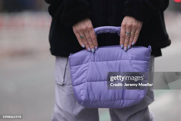 Palina Kozyrava seen wearing Vertere black logo patch fleece jacket, Vertere black logo print pattern cotton t-shirt, pastel purple nylon cargo...