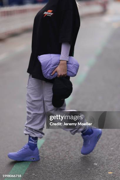 Palina Kozyrava seen wearing Vertere black logo pattern cap, Vertere black logo print pattern cotton t-shirt, pastel purple nylon cargo pants,...