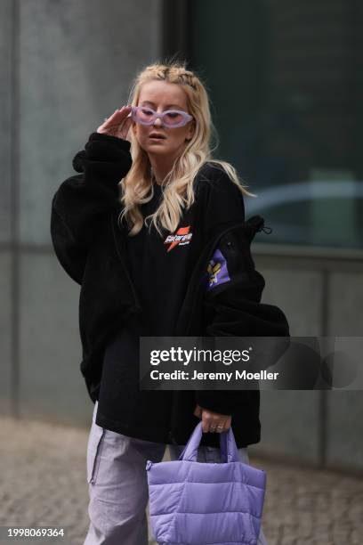 Palina Kozyrava seen wearing purple transparent sunglasses, Vertere black logo patch fleece jacket, Vertere black logo print pattern cotton t-shirt,...