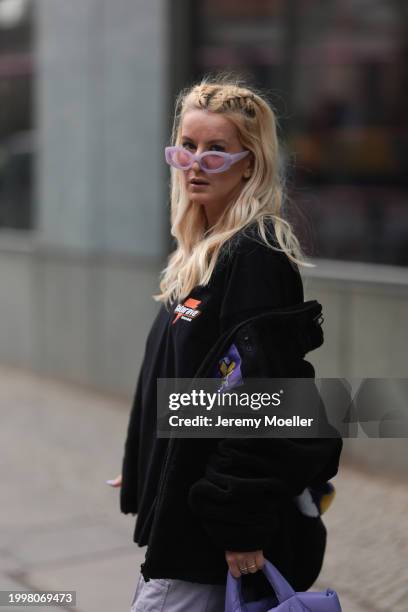 Palina Kozyrava seen wearing purple transparent sunglasses, Vertere black logo patch fleece jacket, Vertere black logo print pattern cotton t-shirt,...