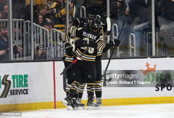 Pavel Zacha of the Boston Bruins celebrates his goal against the Vancouver Canucks with his teammates Matt Grzelcyk, James van Riemsdyk and David...