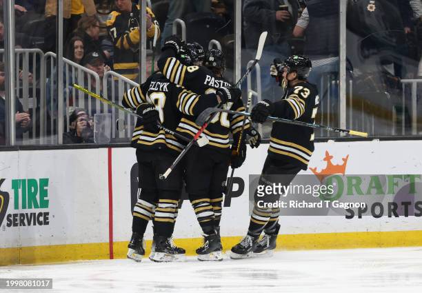 Pavel Zacha of the Boston Bruins celebrates his goal against the Vancouver Canucks with his teammates Charlie McAvoy, Matt Grzelcyk, James van...