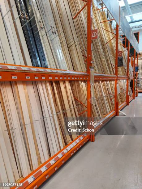 stand with various wooden moldings in a hardware store - household equipment stock pictures, royalty-free photos & images
