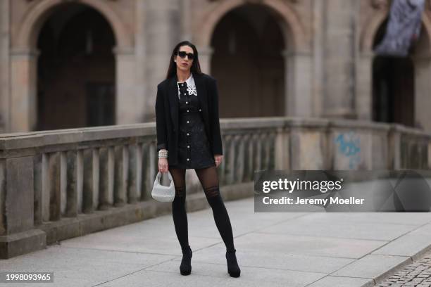 Sara Lazarevic seen wearing black sunglasses, silver diamond earrings, black elegant blazer jacket, black flower embroidered dress with a white lace...