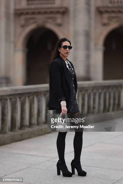 Sara Lazarevic seen wearing black sunglasses, silver diamond earrings, black elegant blazer jacket, black flower embroidered dress with a white lace...