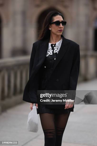 Sara Lazarevic seen wearing black sunglasses, silver diamond earrings, black elegant blazer jacket, black flower embroidered dress with a white lace...