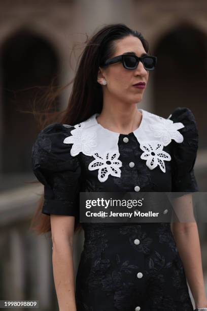 Sara Lazarevic seen wearing black sunglasses, silver diamond earrings, black flower embroidered dress with a white lace collar and puff sleeves, on...