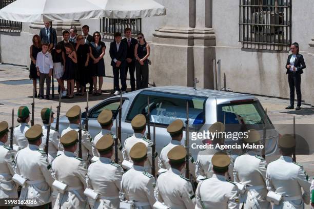 Cecilia Morel alongside her children and grandchildren await the hearse carrying former president Sebastian Piñera at La Moneda palace during the...