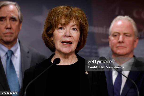 Sen. Tina Smith talks to reporters with Sen. Jeff Merkley and Sen. Chris Van Hollen during a news conference at the U.S. Capitol to celebrate a new...