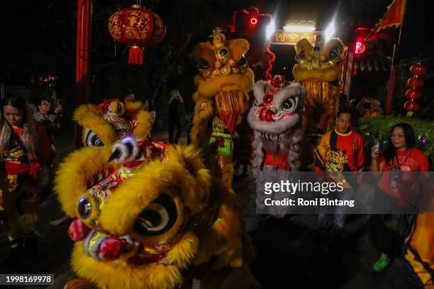 Lion dance team from Australian Yau Kung Mun Association before a perform at Sze Yup Kwan Ti temple during Lunar New Year's Eve celebration at Sze...