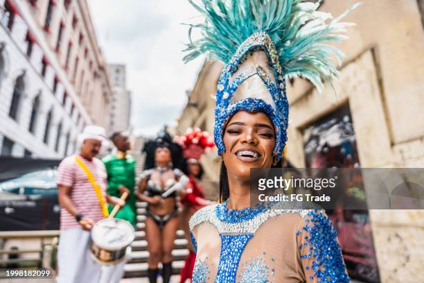 portrait of a young woman at a street carnival party - carnaval rio stock pictures, royalty-free photos & images