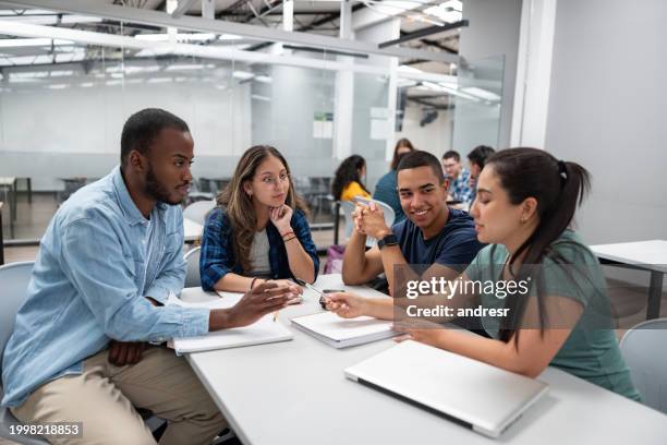 group of students studying together in the classroom - adult college student stock pictures, royalty-free photos & images