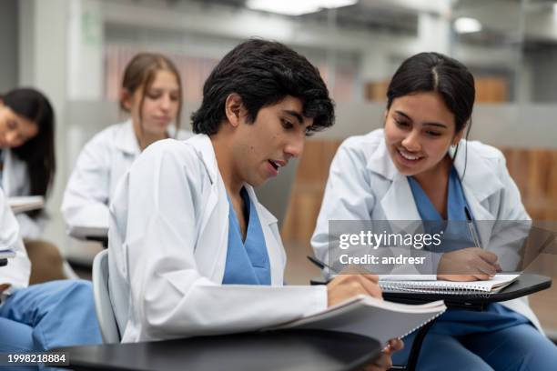 happy medical students talking in class - estudante de medicina imagens e fotografias de stock