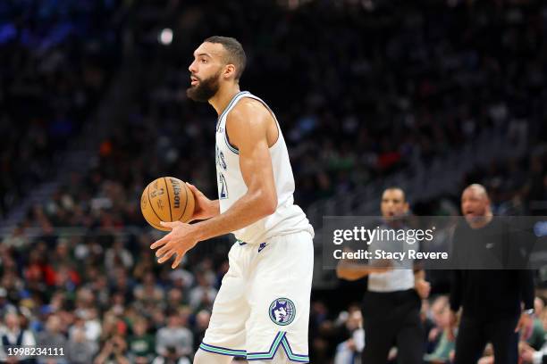 Rudy Gobert of the Minnesota Timberwolves handles the ball during a game against the Milwaukee Bucks at Fiserv Forum on February 08, 2024 in...