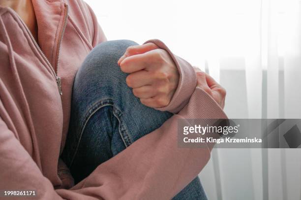 emotional stress - pink pants stock pictures, royalty-free photos & images