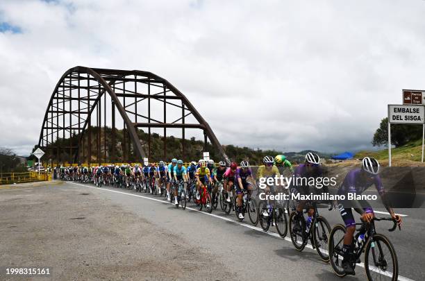 Rodrigo Contreras of Colombia and Team Nu Colombia - Yellow Leader Jersey and a general view of the peloton passing a bridge over the Sisga dam...