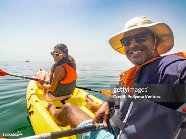 tourists taking a selfie in kayak - eco tourism stock pictures, royalty-free photos & images