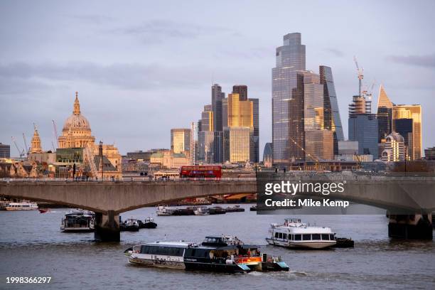 City of London skyline view looking over the River Thames and Waterloo Bridge at sunset on 10th February 2024 in London, United Kingdom. The City of...