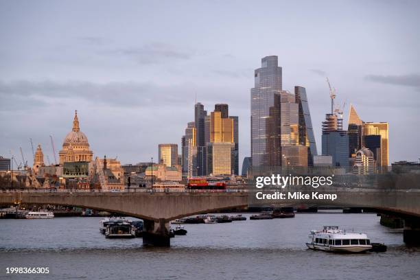 City of London skyline view looking over the River Thames and Waterloo Bridge at sunset on 10th February 2024 in London, United Kingdom. The City of...