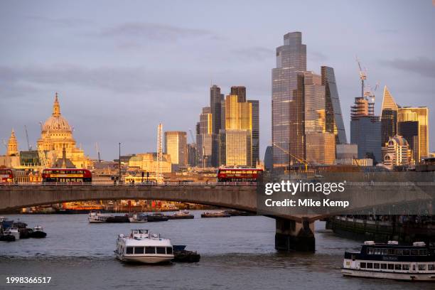 City of London skyline view looking over the River Thames and Waterloo Bridge at sunset on 10th February 2024 in London, United Kingdom. The City of...