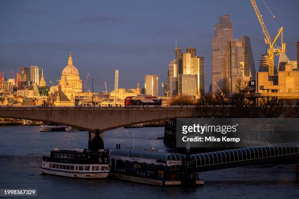 City of London skyline view looking over the River Thames and Waterloo Bridge at sunset on 10th February 2024 in London, United Kingdom. The City of...