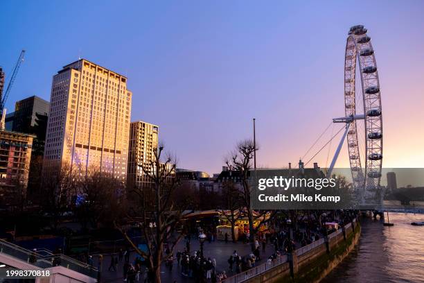 View of the South Bank at sunset towards the London Eye and Shell Centre on 10th February 2024 in London, United Kingdom. Big Ben is the nickname for...