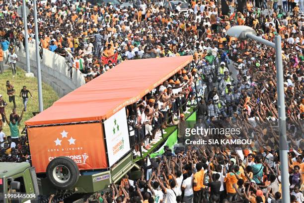 Ivory Coast players, winners of the 2024 African Cup of Nations , parade in a truck on the Alassane Ouattara bridge in Abidjan, on February 12, 2024.