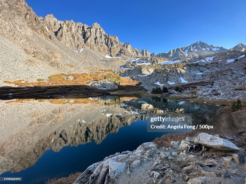 Scenic view of lake and snowcapped mountains against clear blue sky,Bishop,California,United States,USA