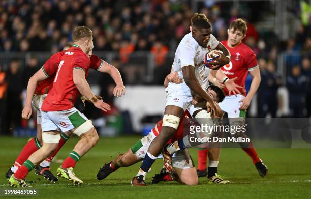 Junior Kpoku of England is tackled by Harry Thomas of Wales during the U20 Six Nations match between England and Wales at The Recreation Ground on...