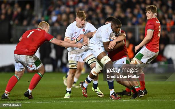 Junior Kpoku of England is tackled by Harry Thomas of Wales during the U20 Six Nations match between England and Wales at The Recreation Ground on...