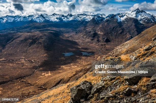 aerial view of snowcapped mountains against sky - spring 2013 stock pictures, royalty-free photos & images