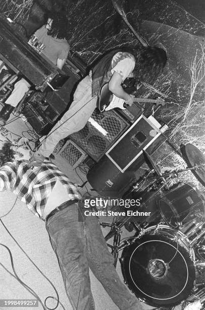 Members of American Rock band Blues Traveler perform on stage at the 712 Club, New York, New York, April 9, 1990. Pictured are, from top, Avram...