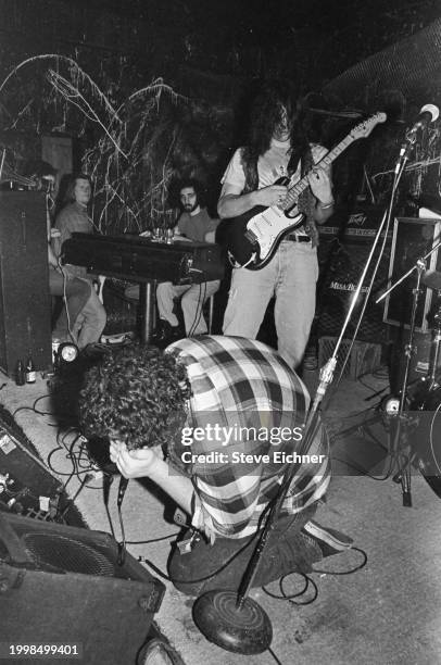 Members of American Rock band Blues Traveler perform on stage at the 712 Club, New York, New York, April 9, 1990. Pictured are, rear, from left,...